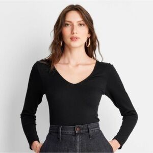 A new day stretchy nylon/spandex v neck long sleeve black top
